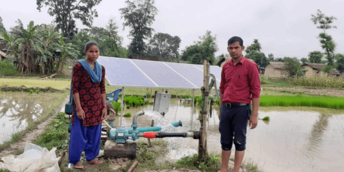 Farmers with their solar water pump installation